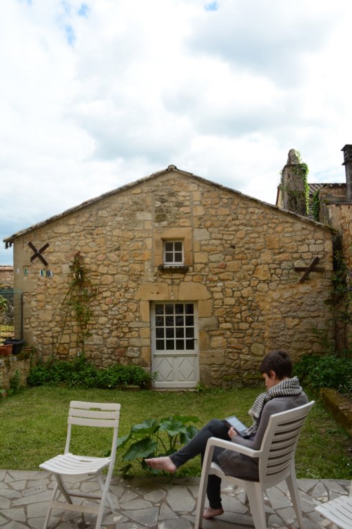 andelizabethrelaxesinthegardenthechambredufondusedtobeasheepbarn.jpg